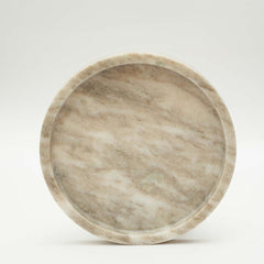 Close-up of handcrafted natural marble round tray texture