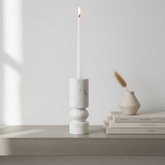 Banswara marble candle holder with white candle styled on a minimalist console table