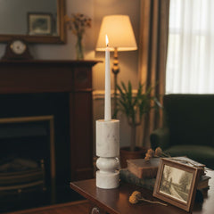 Banswara marble candle holder with lit candle displayed on a side table in a luxury living room