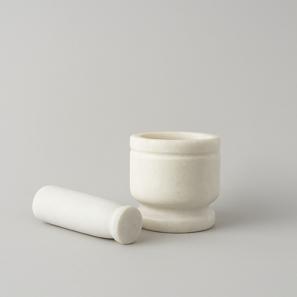 White marble mortar and pestle set isolated on light background
