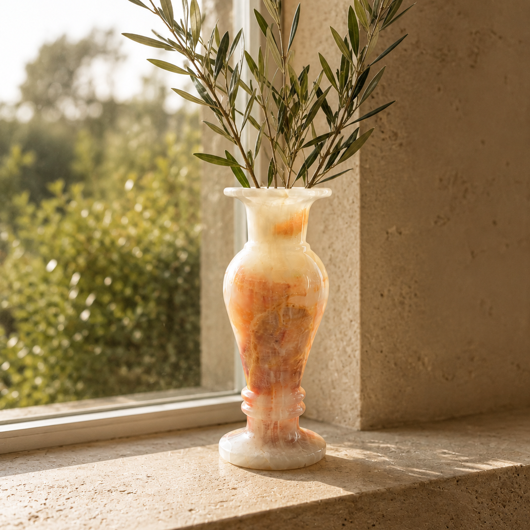 Luxury Onyx Marble Flower Vase with green foliage near a bright window