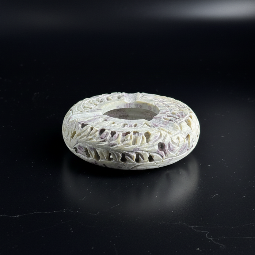 Premium Hand-Carved Soapstone Ash Tray with intricate patterns on a black background