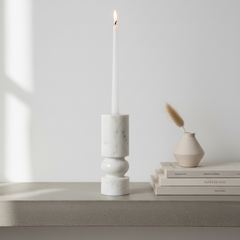 Banswara marble candle holder with white candle styled on a minimalist console table
